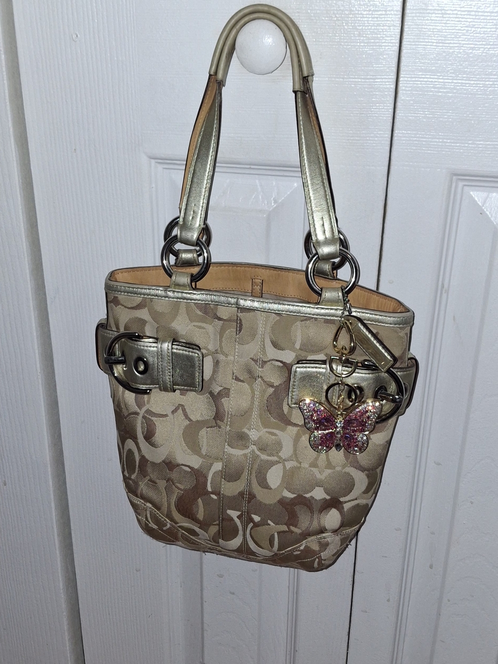 Coach Beige Signature Tote with Gold Accents and Butterfly Charm